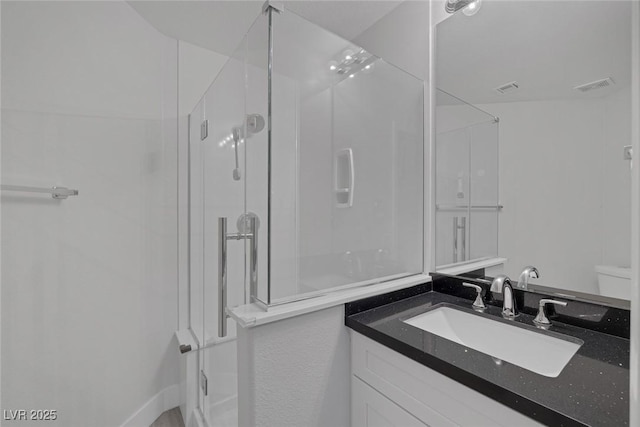 10113 Plomosa Pl, Las Vegas, NV 89134 - bathroom with a shower stall, vanity, and toilet