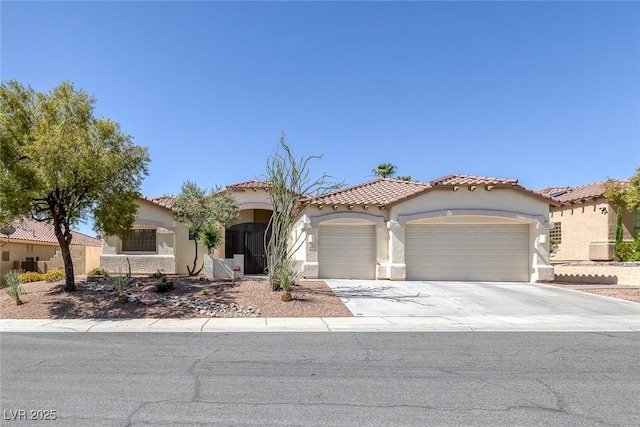 10113 Plomosa Pl, Las Vegas, NV 89134 - mediterranean / spanish house with an attached garage, stucco siding, concrete driveway, and a tiled roof