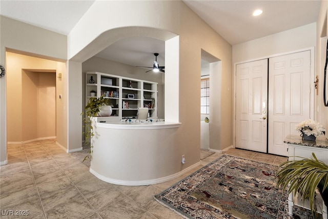1413 Gentle Brook St, North Las Vegas, NV 89084 - foyer entrance with ceiling fan, light tile patterned floors, and arched walkways