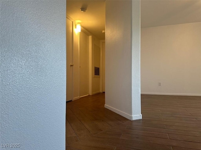 698 S Racetrack Rd Unit 1411, Henderson, NV 89015 - hallway with dark wood-style floors and baseboards