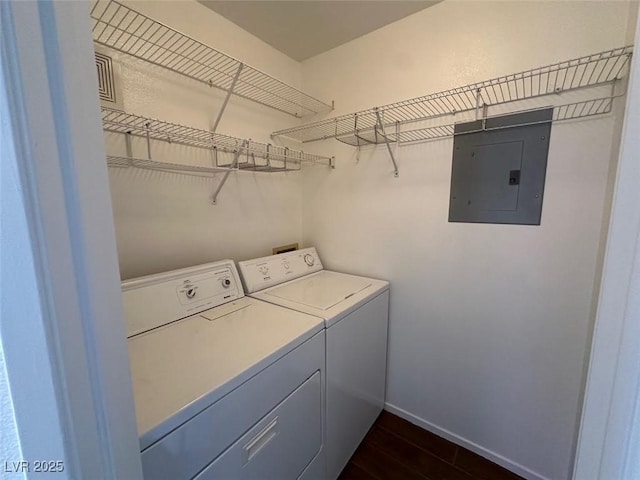 698 S Racetrack Rd Unit 1411, Henderson, NV 89015 - washroom with electric panel, washer and dryer, dark wood-style flooring, and baseboards