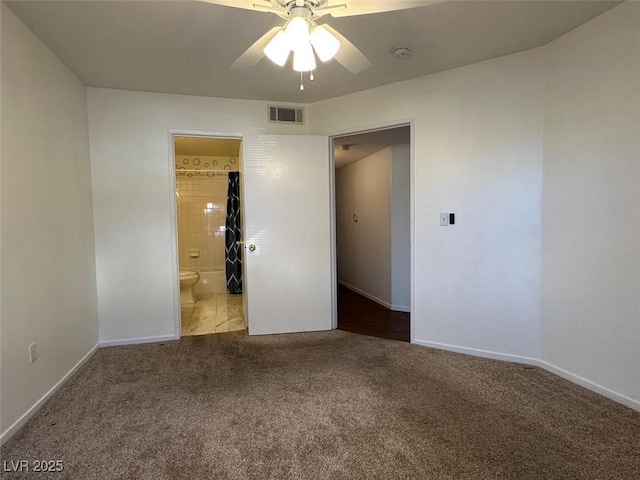698 S Racetrack Rd Unit 1411, Henderson, NV 89015 - unfurnished bedroom with carpet flooring, connected bathroom, baseboards, and ceiling fan
