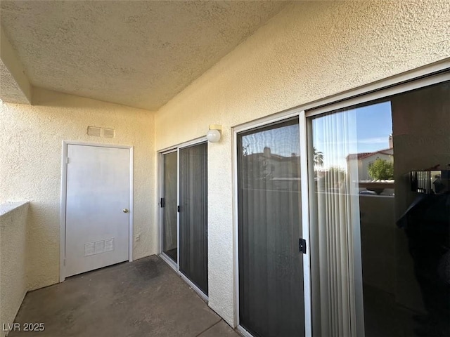 698 S Racetrack Rd Unit 1411, Henderson, NV 89015 - view of exterior entry featuring stucco siding and a balcony