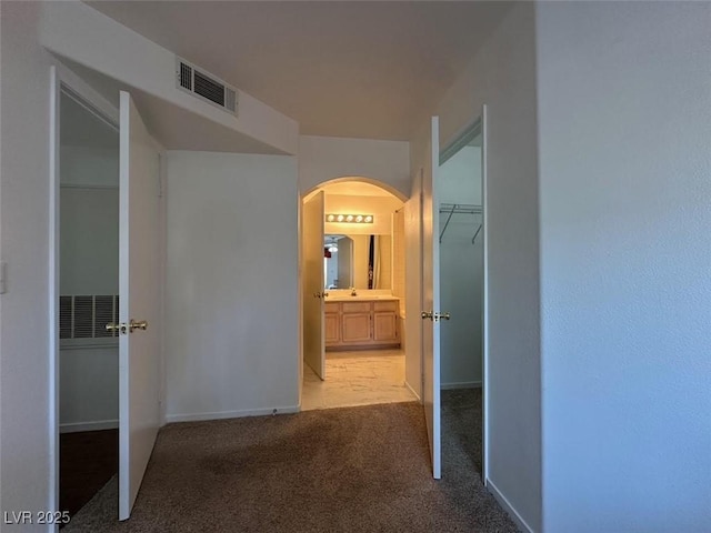 698 S Racetrack Rd Unit 1411, Henderson, NV 89015 - hall with arched walkways, carpet, and baseboards
