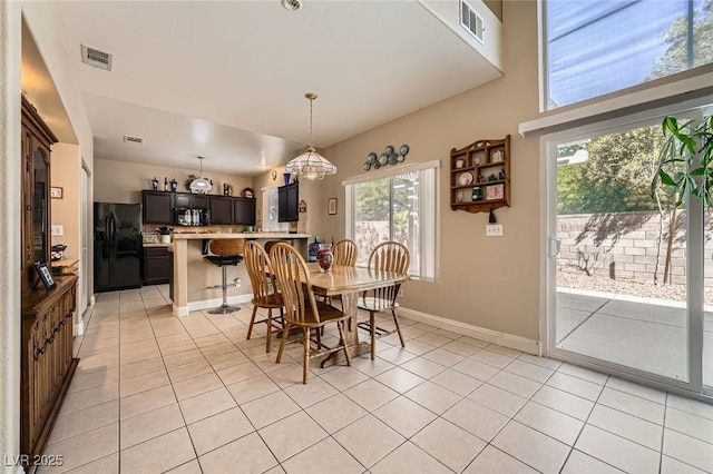 1116 Avellino Ln, Las Vegas, NV 89144 - dining space featuring healthy amount of natural light, light tile patterned floors, and baseboards