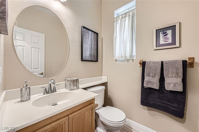 1116 Avellino Ln, Las Vegas, NV 89144 - bathroom featuring toilet, vanity, and baseboards