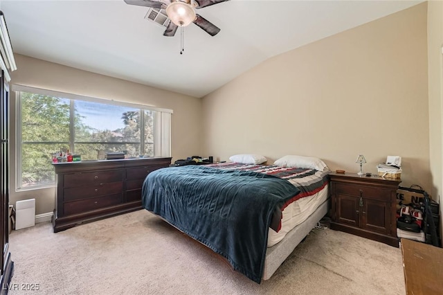 1116 Avellino Ln, Las Vegas, NV 89144 - bedroom with multiple windows, light colored carpet, vaulted ceiling, and a ceiling fan