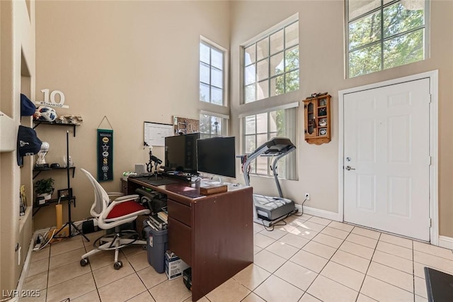 1116 Avellino Ln, Las Vegas, NV 89144 - office area with a high ceiling, light tile patterned flooring, and baseboards