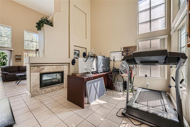 1116 Avellino Ln, Las Vegas, NV 89144 - interior space with a high ceiling, a multi sided fireplace, and light tile patterned floors