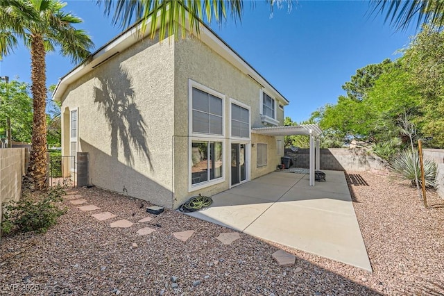 1116 Avellino Ln, Las Vegas, NV 89144 - back of house featuring stucco siding, a fenced backyard, a patio area, and a pergola