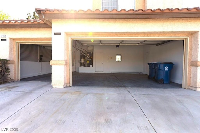 1721 Mill Canyon Dr, Las Vegas, NV 89128 - garage featuring concrete driveway and heating unit