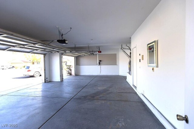 1721 Mill Canyon Dr, Las Vegas, NV 89128 - garage featuring a garage door opener and baseboards