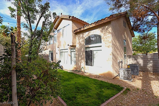 1721 Mill Canyon Dr, Las Vegas, NV 89128 - back of property featuring stucco siding, a tile roof, and central AC