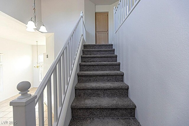 1721 Mill Canyon Dr, Las Vegas, NV 89128 - stairway with a chandelier and tile patterned floors