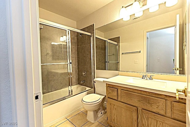 1721 Mill Canyon Dr, Las Vegas, NV 89128 - full bathroom with toilet, vanity, tile patterned floors, and combined bath / shower with glass door