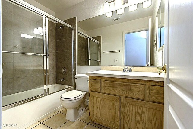 1721 Mill Canyon Dr, Las Vegas, NV 89128 - full bath featuring toilet, vanity, tile patterned flooring, and enclosed tub / shower combo