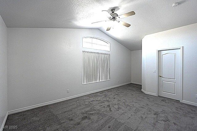 1721 Mill Canyon Dr, Las Vegas, NV 89128 - bonus room featuring vaulted ceiling, ceiling fan, dark colored carpet, baseboards, and a textured ceiling