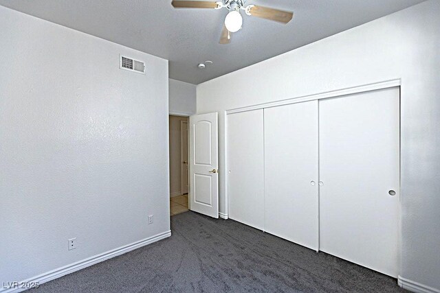 1721 Mill Canyon Dr, Las Vegas, NV 89128 - unfurnished bedroom featuring carpet flooring, a closet, baseboards, and a ceiling fan