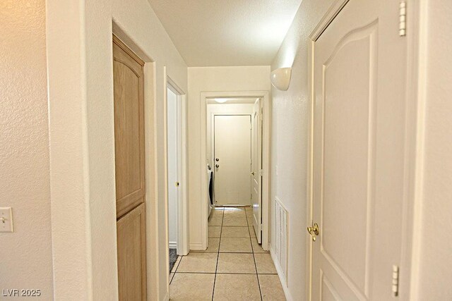 1721 Mill Canyon Dr, Las Vegas, NV 89128 - corridor featuring light tile patterned floors