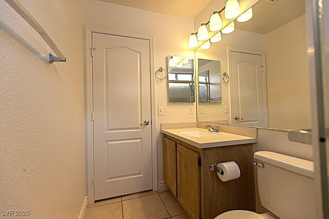 1721 Mill Canyon Dr, Las Vegas, NV 89128 - half bath with tile patterned flooring, vanity, toilet, and a textured wall