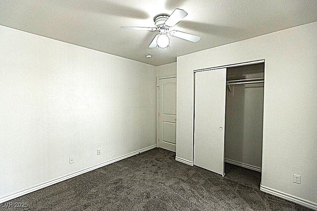 1721 Mill Canyon Dr, Las Vegas, NV 89128 - unfurnished bedroom featuring dark colored carpet, a closet, ceiling fan, and baseboards