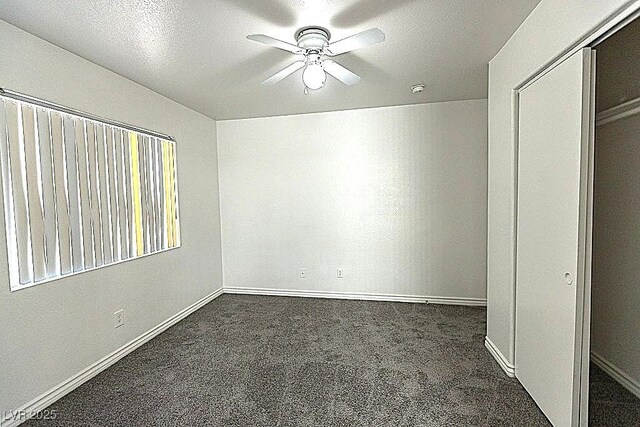 1721 Mill Canyon Dr, Las Vegas, NV 89128 - unfurnished bedroom featuring carpet, baseboards, ceiling fan, and a closet