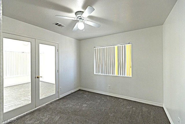 1721 Mill Canyon Dr, Las Vegas, NV 89128 - empty room with french doors, dark colored carpet, a ceiling fan, and baseboards