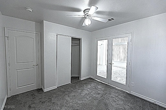 1721 Mill Canyon Dr, Las Vegas, NV 89128 - unfurnished bedroom with french doors, dark colored carpet, a closet, a ceiling fan, and baseboards