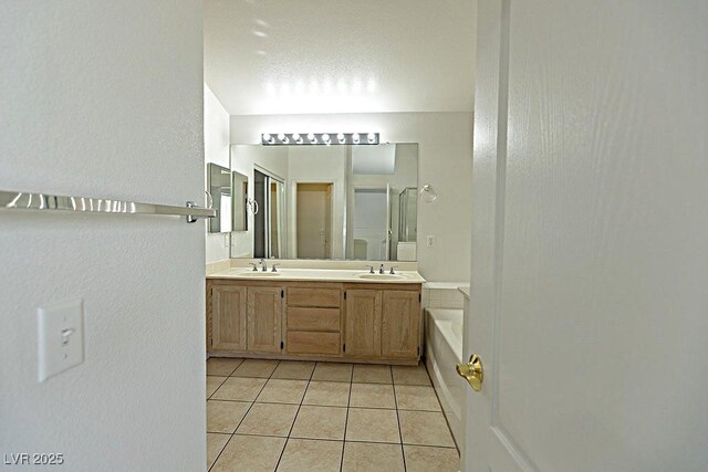 1721 Mill Canyon Dr, Las Vegas, NV 89128 - bathroom with tile patterned floors, double vanity, a bath, and a stall shower