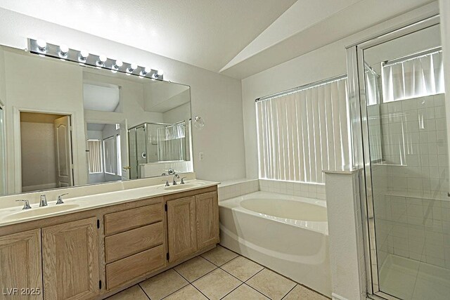 1721 Mill Canyon Dr, Las Vegas, NV 89128 - full bath with a stall shower, a bath, double vanity, tile patterned floors, and vaulted ceiling