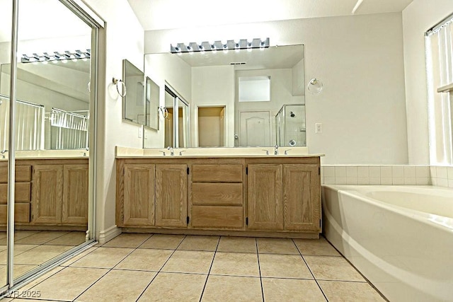 1721 Mill Canyon Dr, Las Vegas, NV 89128 - full bathroom featuring tile patterned floors, a stall shower, double vanity, and a bath