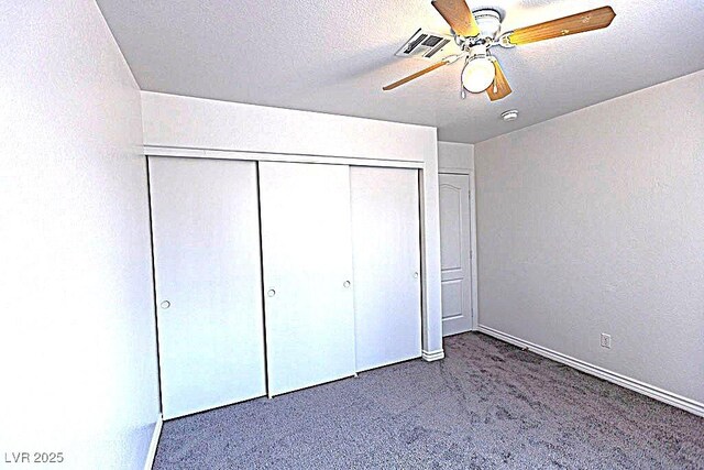 1721 Mill Canyon Dr, Las Vegas, NV 89128 - unfurnished bedroom featuring carpet, a closet, ceiling fan, and baseboards