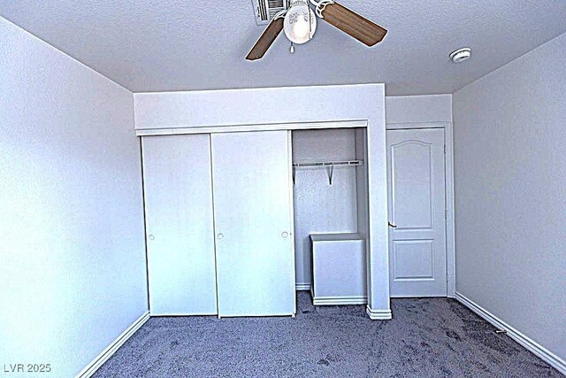 1721 Mill Canyon Dr, Las Vegas, NV 89128 - unfurnished bedroom with carpet, a closet, baseboards, and a textured ceiling