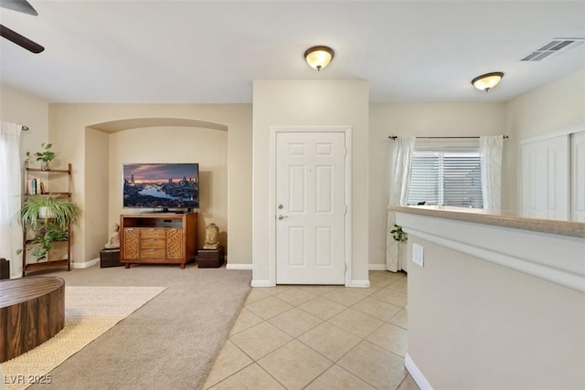 1101 Elation Ln Unit 2, Henderson, NV 89002 - entryway featuring a ceiling fan, light tile patterned floors, baseboards, and light colored carpet