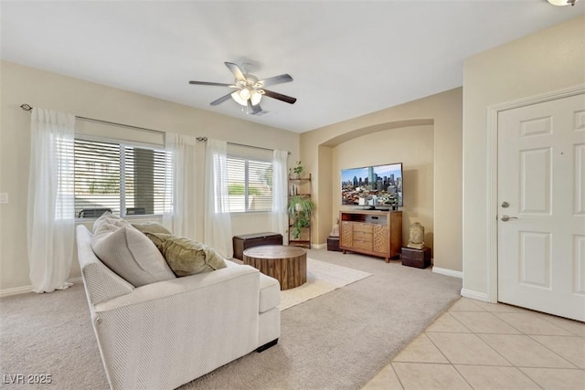 1101 Elation Ln Unit 2, Henderson, NV 89002 - living room with light carpet, a ceiling fan, baseboards, and light tile patterned floors
