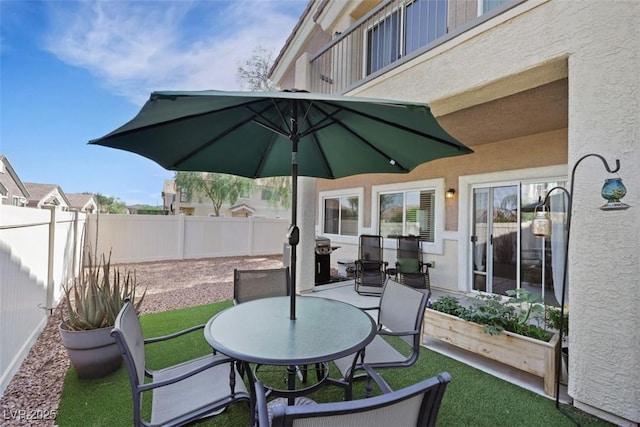 1101 Elation Ln Unit 2, Henderson, NV 89002 - fenced backyard featuring a patio area and outdoor dining space