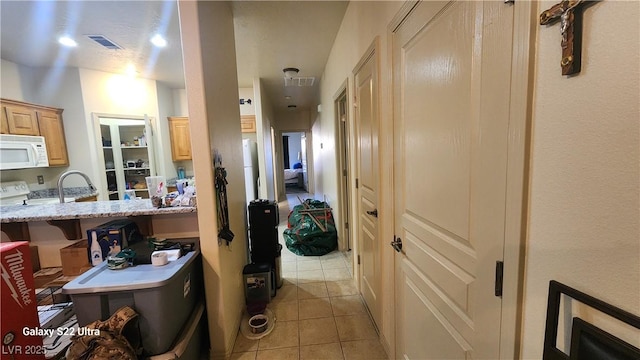 864 Chianti Way, Mesquite, NV 89027 - hallway featuring light tile patterned floors and a sink