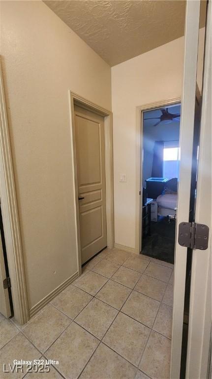 864 Chianti Way, Mesquite, NV 89027 - hallway featuring light tile patterned floors and a textured ceiling