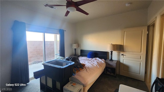 864 Chianti Way, Mesquite, NV 89027 - bedroom with dark colored carpet and a ceiling fan