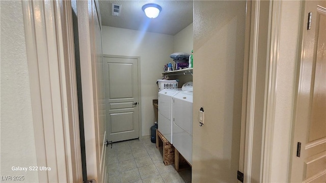 864 Chianti Way, Mesquite, NV 89027 - laundry area featuring washing machine and clothes dryer and light tile patterned floors