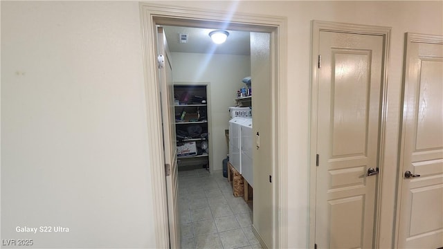 864 Chianti Way, Mesquite, NV 89027 - hallway featuring washer and clothes dryer and light tile patterned floors