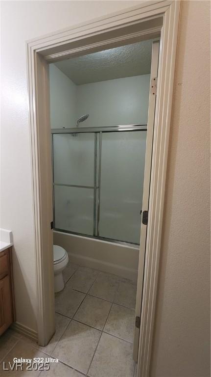 864 Chianti Way, Mesquite, NV 89027 - bathroom featuring vanity, tile patterned flooring, toilet, and bath / shower combo with glass door