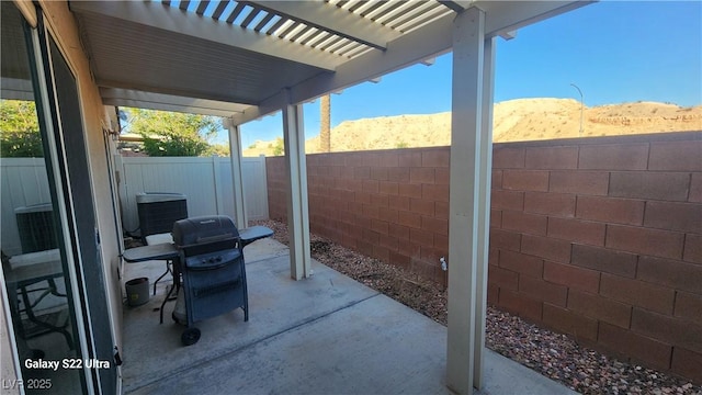 864 Chianti Way, Mesquite, NV 89027 - fenced backyard featuring a patio area, a grill, and cooling unit
