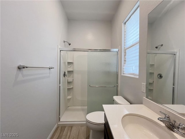 12565 Huckleberry Oak Ave, Las Vegas, NV 89138 - bathroom featuring a stall shower, wood finished floors, vanity, and toilet
