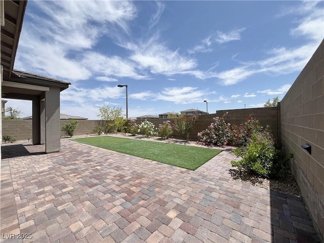 12565 Huckleberry Oak Ave, Las Vegas, NV 89138 - fenced backyard featuring a patio area