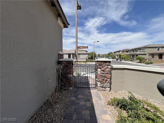12565 Huckleberry Oak Ave, Las Vegas, NV 89138 - gate featuring a residential view