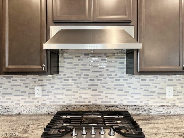 12565 Huckleberry Oak Ave, Las Vegas, NV 89138 - kitchen view of ventilation hood, stainless steel gas cooktop, tasteful backsplash, and dark brown cabinets