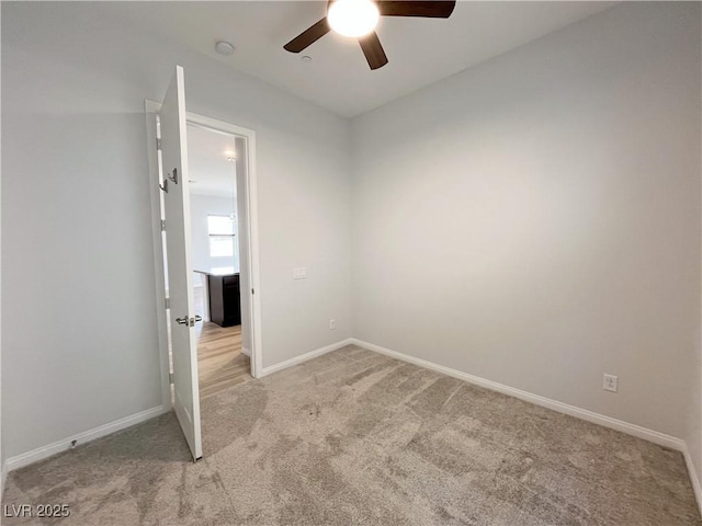 12565 Huckleberry Oak Ave, Las Vegas, NV 89138 - unfurnished room with ceiling fan, light carpet, baseboards, and a smoke detector