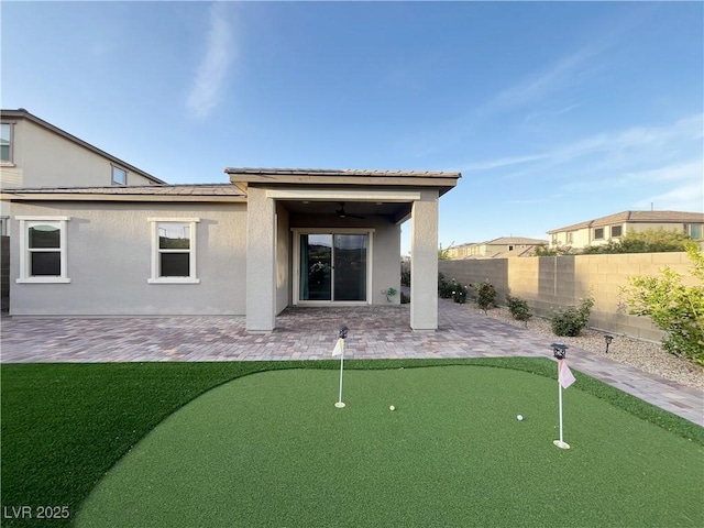 12565 Huckleberry Oak Ave, Las Vegas, NV 89138 - back of house with a putting area, a patio area, and stucco siding