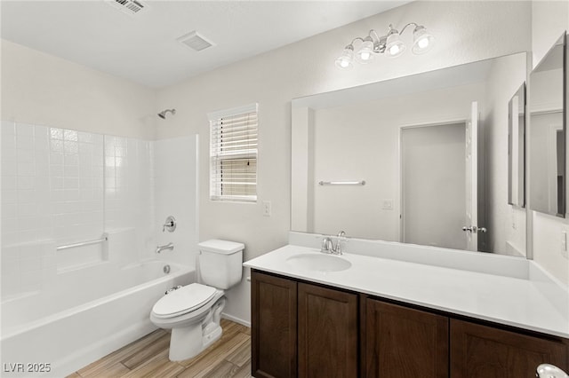 7189 Ashcroft St, North Las Vegas, NV 89084 - full bathroom featuring toilet, wood finished floors, vanity, and shower / bath combination